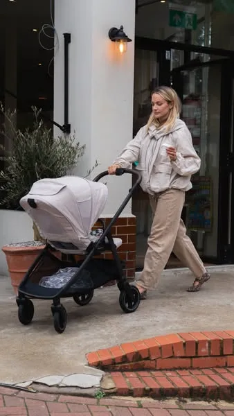Nuna lifestyle / destination ad: With SWIV, Leanne Hainsby can take on tight cafes & narrow sidewalks with one hand on her stroller & the other on her latte.